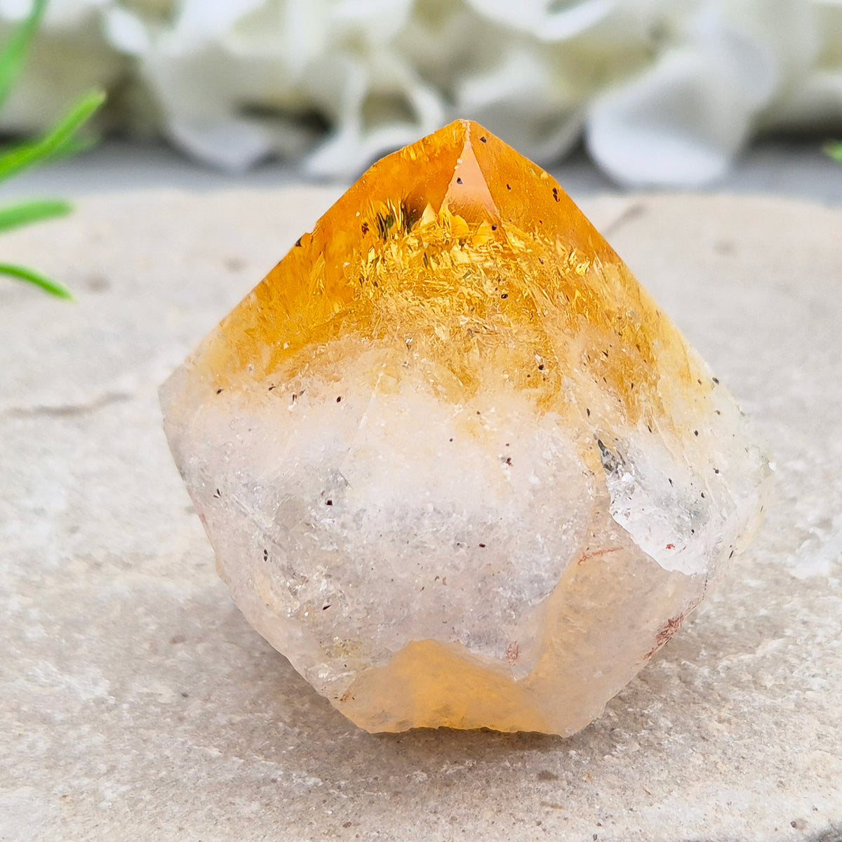 Citrine crystal standing point from Brazil with a polished tip and natural sides. Associated with confidence, motivation, positivity, and personal growth.