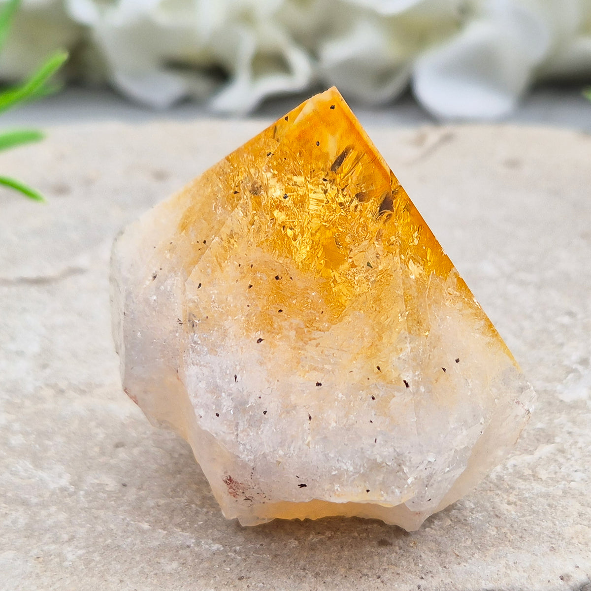 Citrine crystal standing point from Brazil with a polished tip and natural sides. Associated with confidence, motivation, positivity, and personal growth.