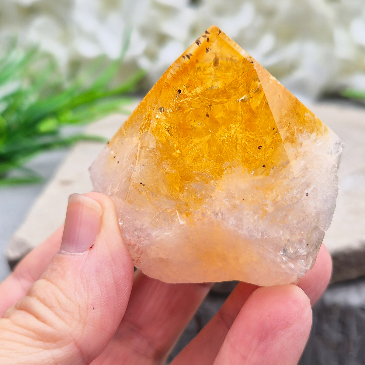 Citrine crystal standing point from Brazil with a polished tip and natural sides. Associated with confidence, motivation, positivity, and personal growth.