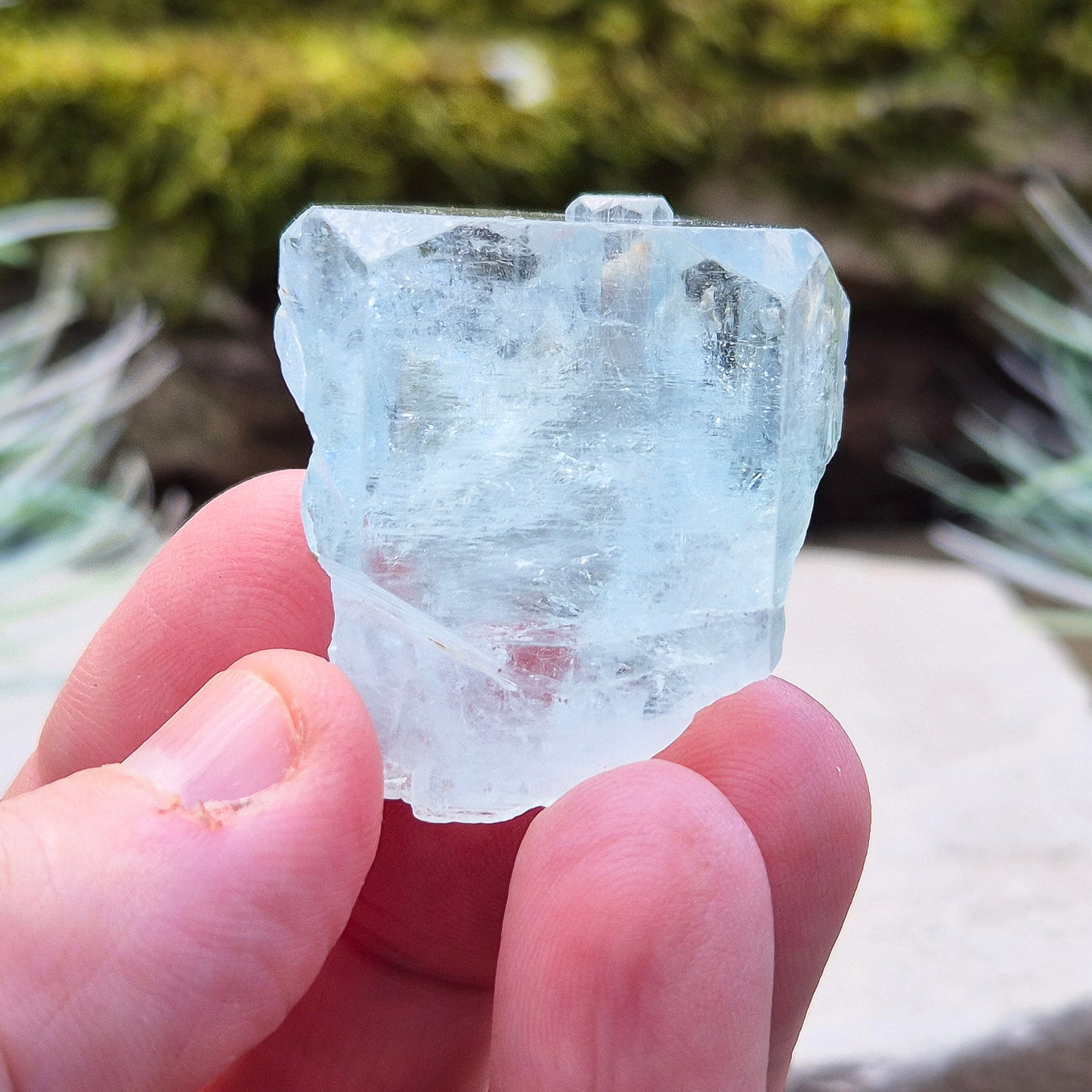 Aquamarine, A grade from India. Lovely pale aqua blue colouring. Hexagonal gemmy crystal with good colour and clarity. Also has some Mica on the back.

weight - 32 gm, length - 3.2 cm at longest, width - 3.2 cm at widest, depth - 2 cm at thickest