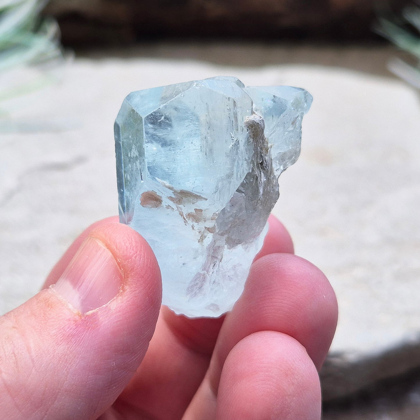 Aquamarine, A grade from India. Lovely pale aqua blue colouring. Hexagonal gemmy crystal with good colour and clarity. Also has some Mica on the back.

weight - 32 gm, length - 3.2 cm at longest, width - 3.2 cm at widest, depth - 2 cm at thickest