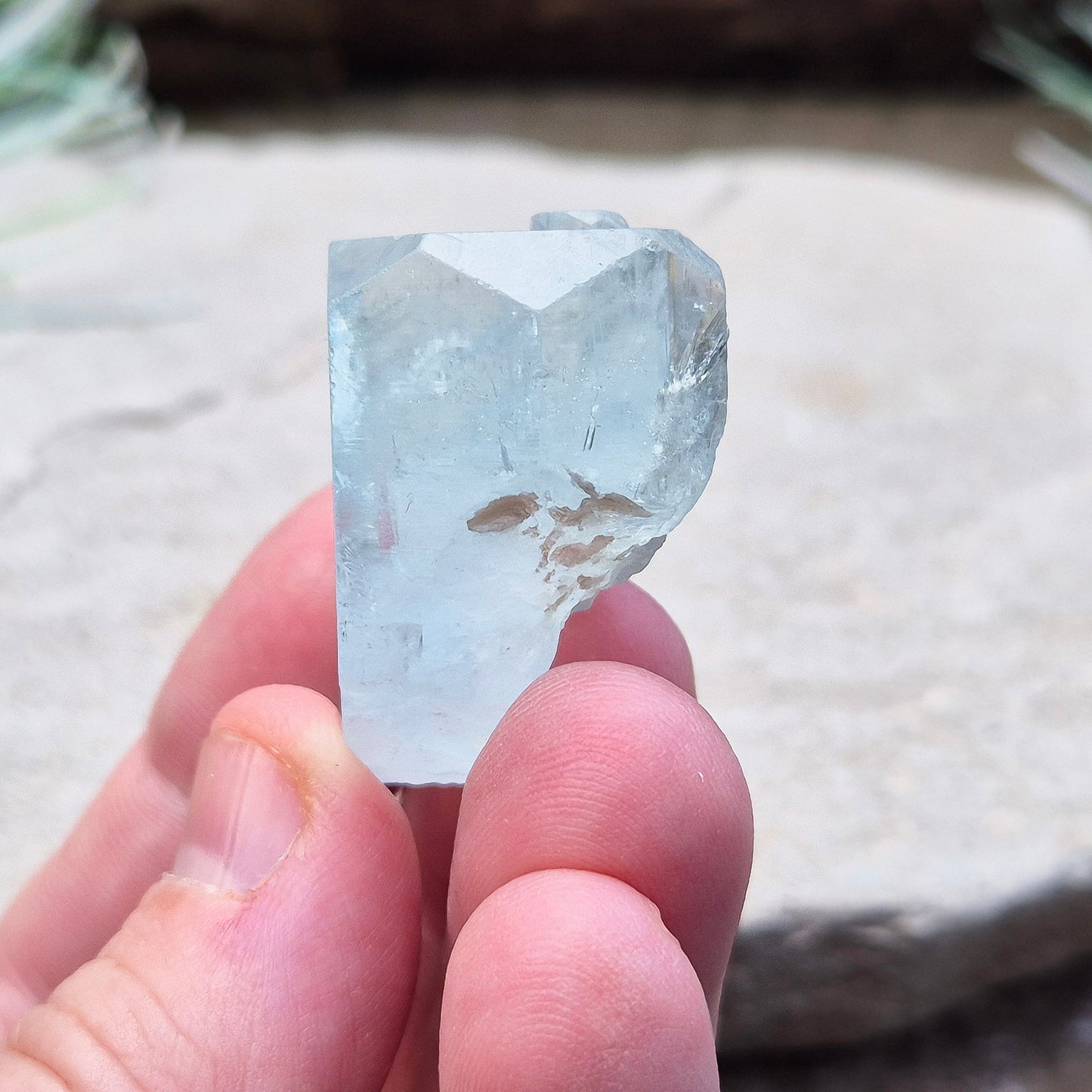 Aquamarine, A grade from India. Lovely pale aqua blue colouring. Hexagonal gemmy crystal with good colour and clarity. Also has some Mica on the back.

weight - 32 gm, length - 3.2 cm at longest, width - 3.2 cm at widest, depth - 2 cm at thickest