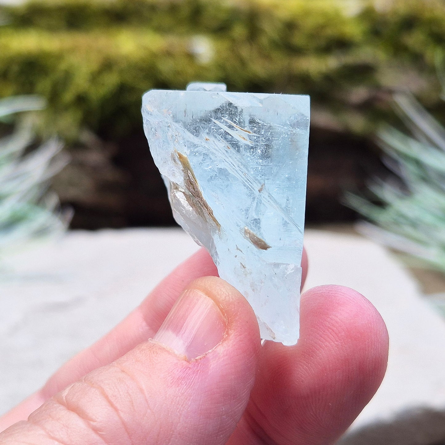 Aquamarine, A grade from India. Lovely pale aqua blue colouring. Hexagonal gemmy crystal with good colour and clarity. Also has some Mica on the back.

weight - 32 gm, length - 3.2 cm at longest, width - 3.2 cm at widest, depth - 2 cm at thickest