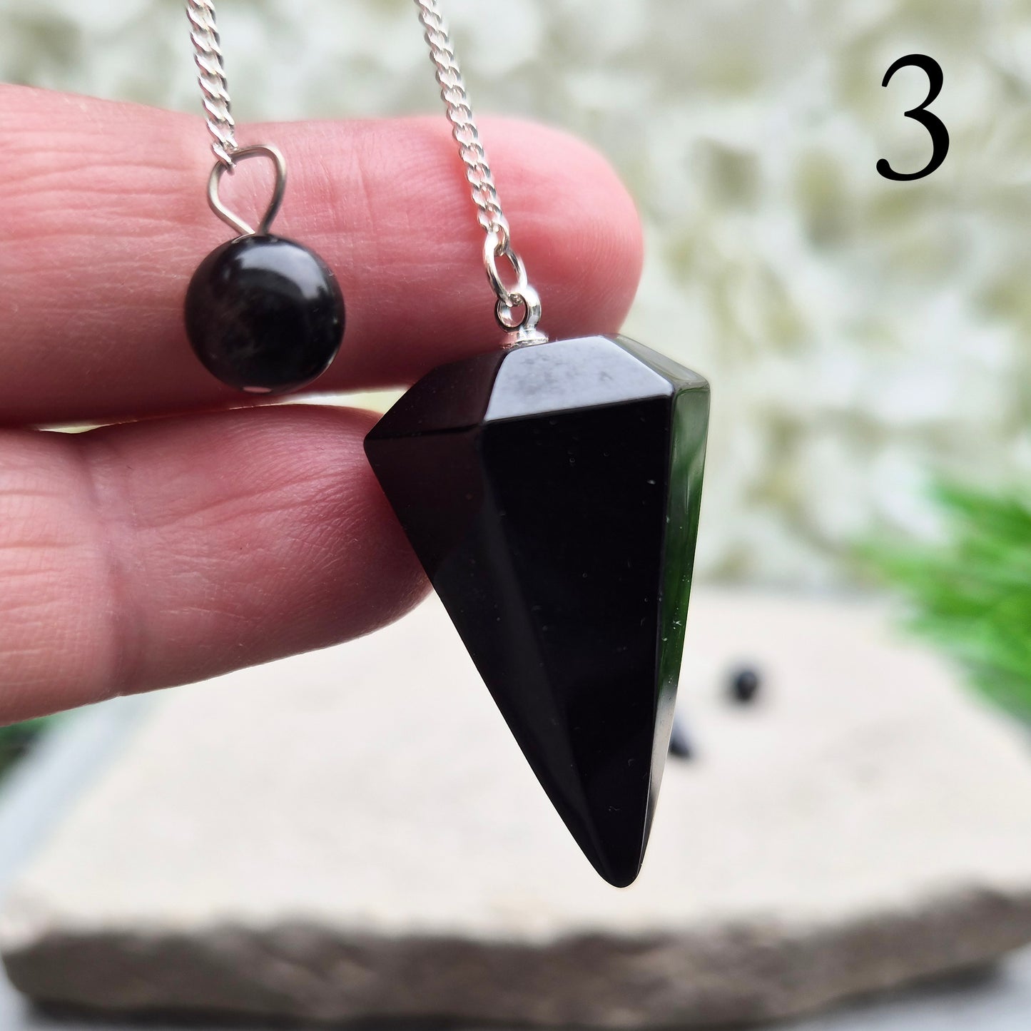 Natural Black Tourmaline crystal pendulum for dowsing, divination, and spiritual work. A grounding stone linked with protection and balance.
