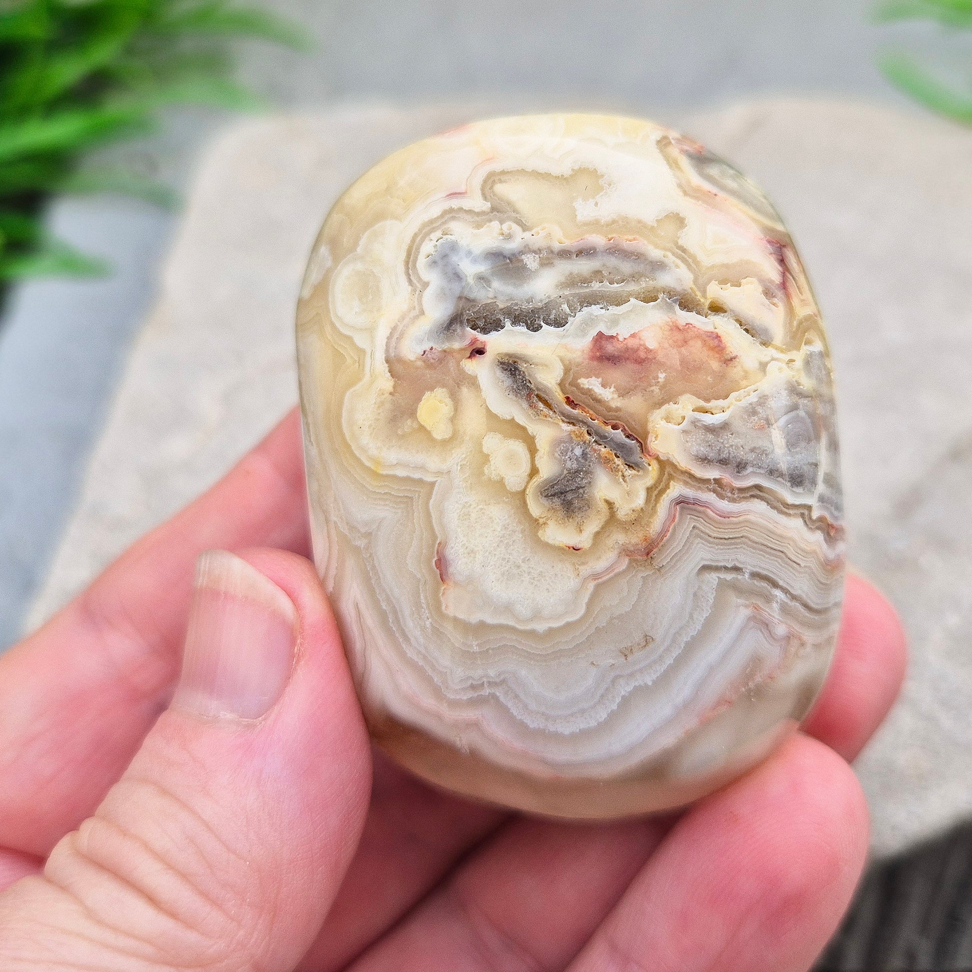 Crazy Lace Agate palm stone—vibrant, swirling patterns for joy, balance & stability. A stone of laughter & positivity. Smooth, soothing & one of a kind.
