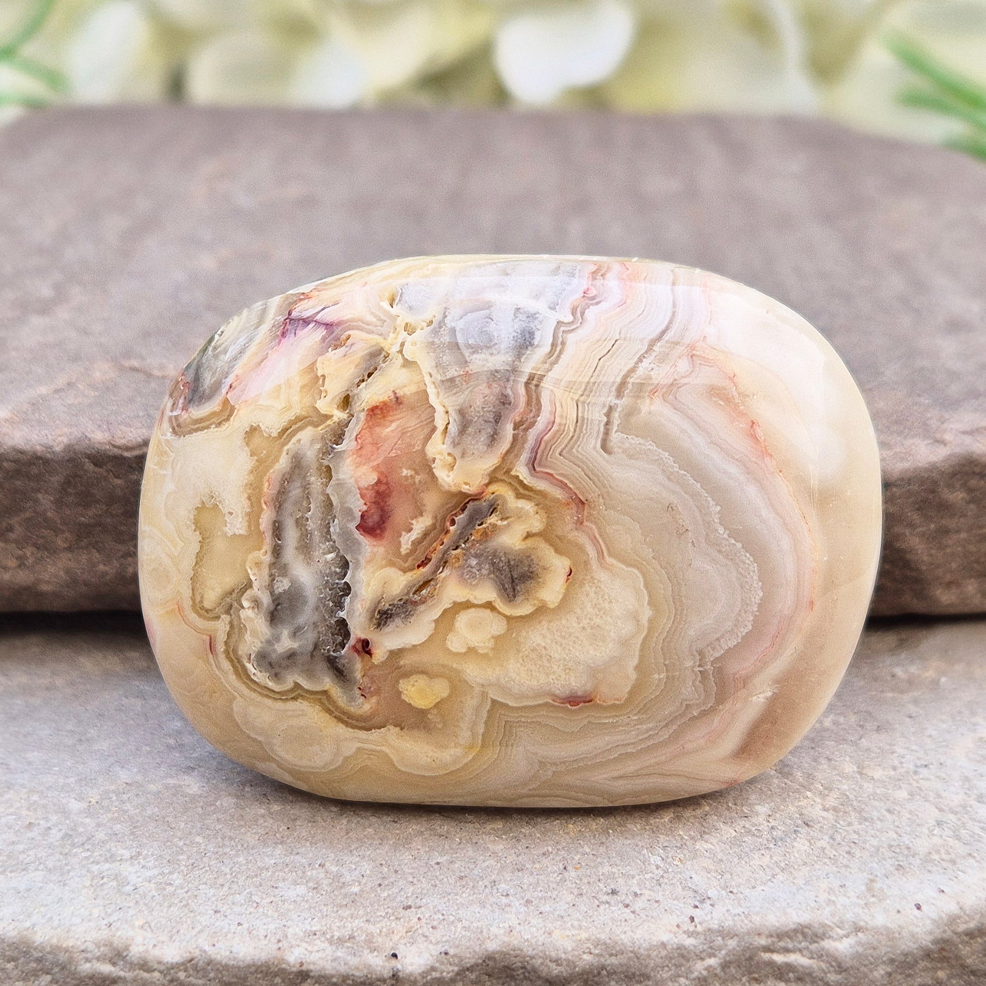 Crazy Lace Agate palm stone—vibrant, swirling patterns for joy, balance & stability. A stone of laughter & positivity. Smooth, soothing & one of a kind.