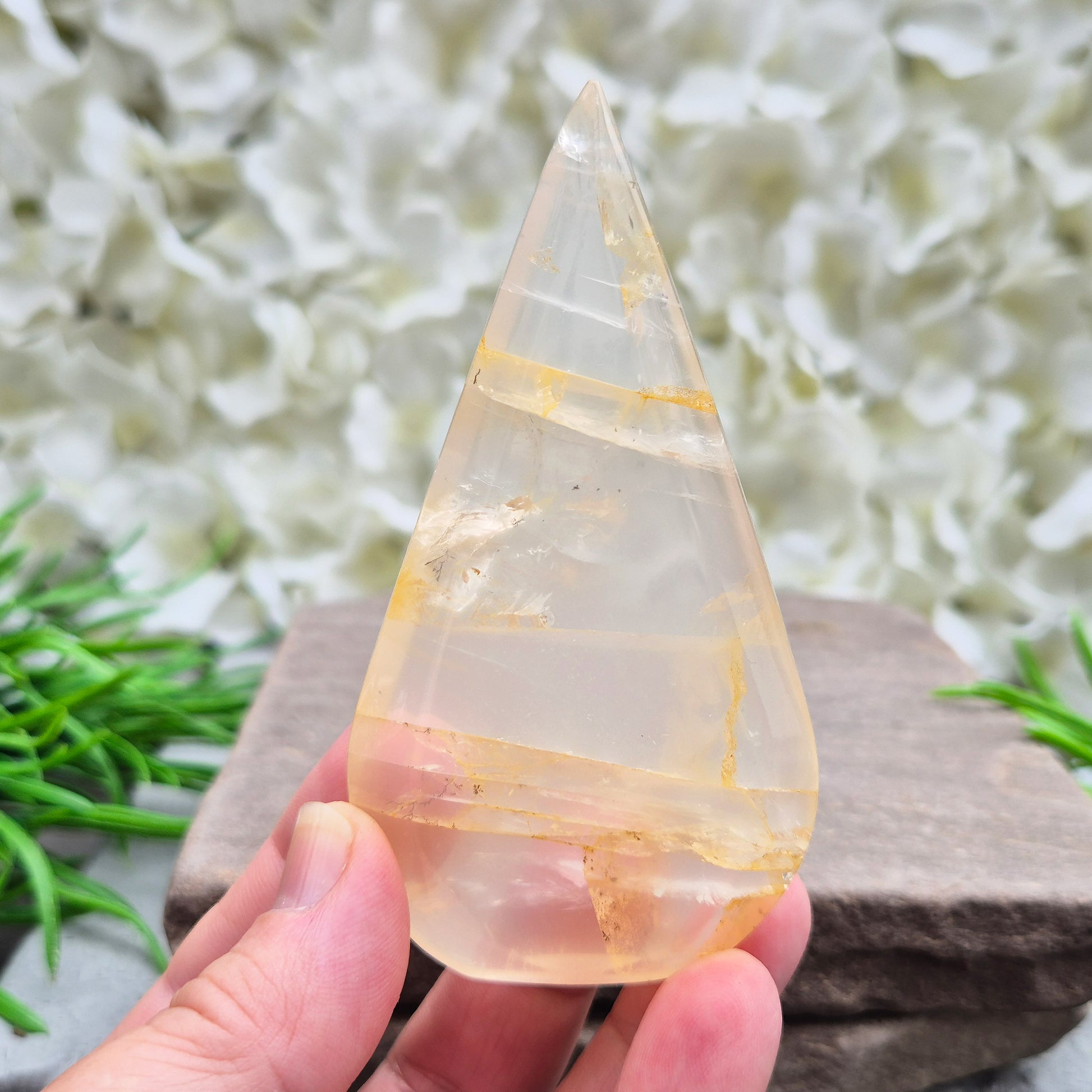 Golden Healer Quartz Teardrop – polished self-standing crystal with golden hematoid inclusions. Brazilian quartz for meditation, altars & spiritual guidance.
