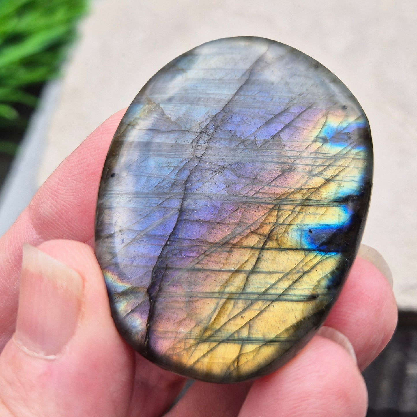 Mystical Labradorite palm stone from Madagascar with vibrant flash. Supports intuition, aura protection & energy clearing. Pocket-sized crystal.