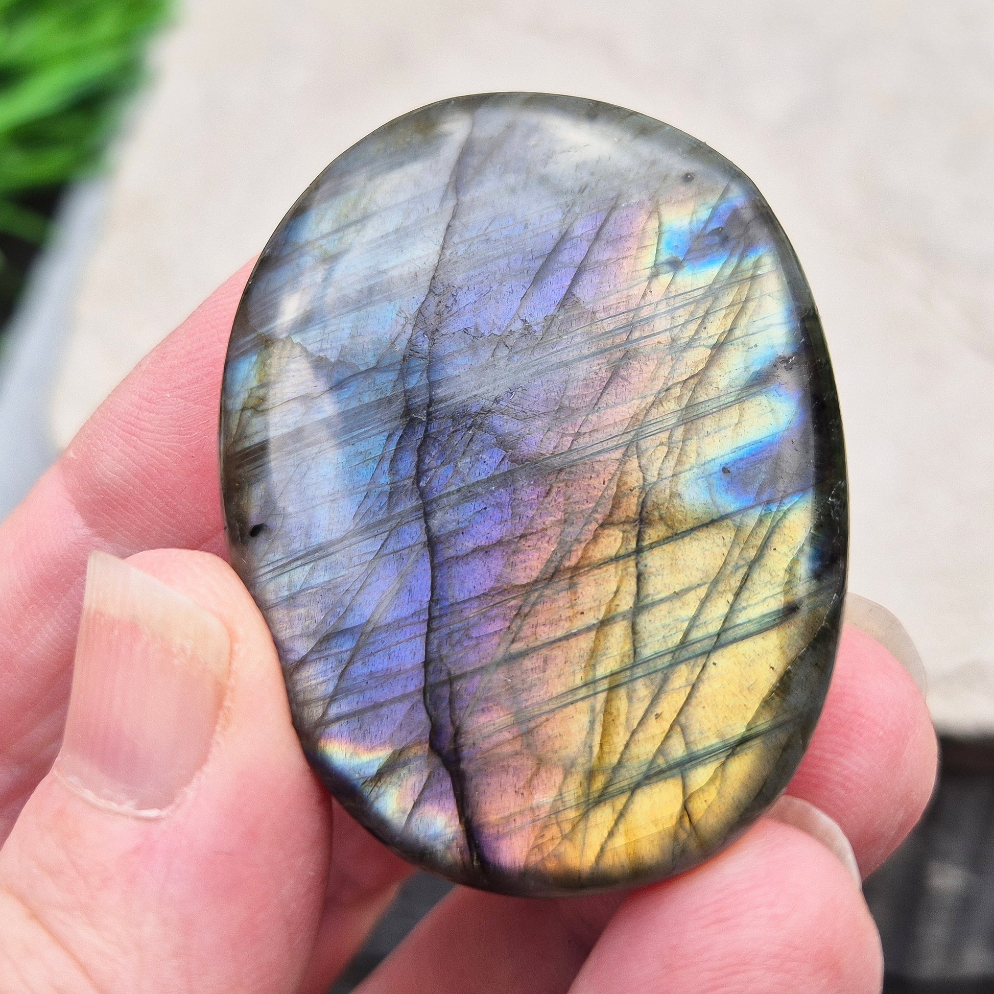 Mystical Labradorite palm stone from Madagascar with vibrant flash. Supports intuition, aura protection & energy clearing. Pocket-sized crystal.