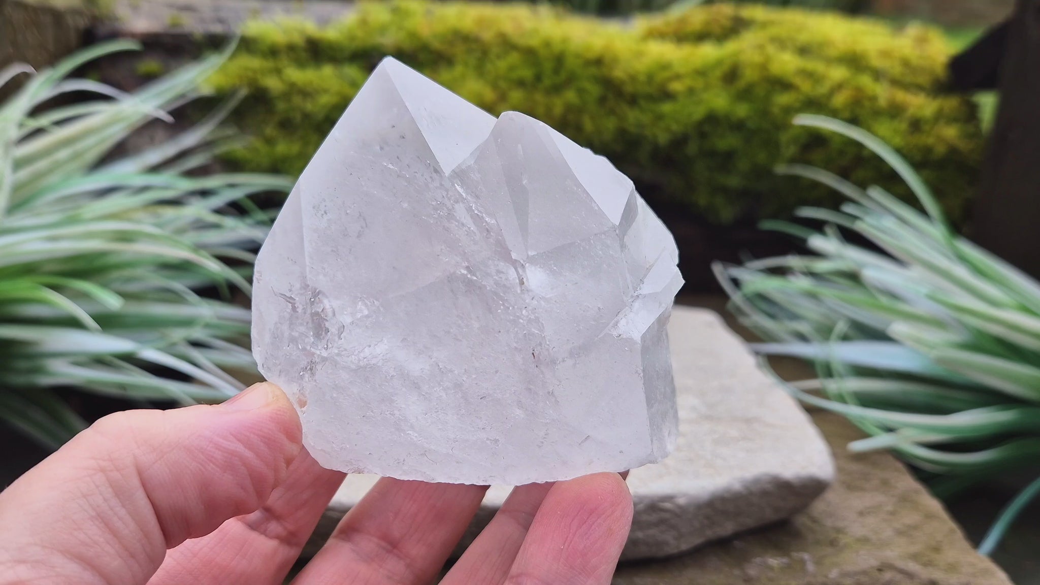 Quartz Crystal Cluster. From Brazil. This cluster comprises of one larger point, a smaller point, and then a companion crystal embedded into the smaller of the 2 points. Will self stand. Base a lovely shine/shimmer to it.