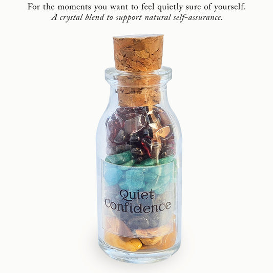 Quiet Confidence crystal blend bottle with garnet, jasper, amazonite and labradorite. A grounding decorative piece for calm self-assurance and self expression.