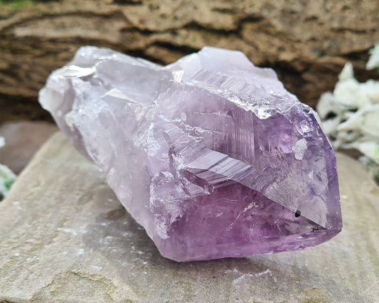 Amethyst Crystal Point from Brazil. A striking piece with deep purple colouring and a polished point. Also known as Amethyst Root.