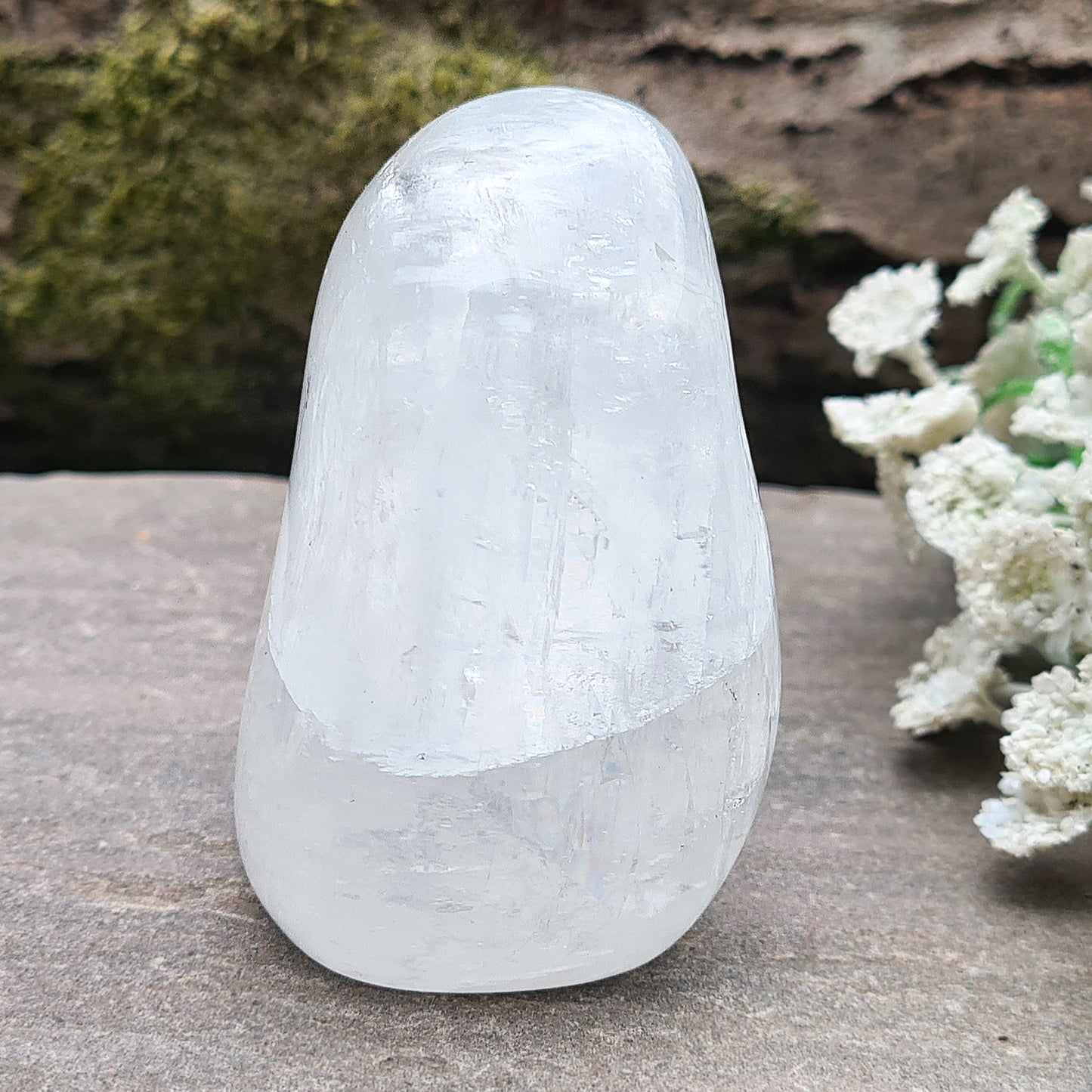Calcite Freeform, White Calcite Freeform. In the light this crystal is very sparkly and a lot of light reflection. There are rainbows within this crystal.