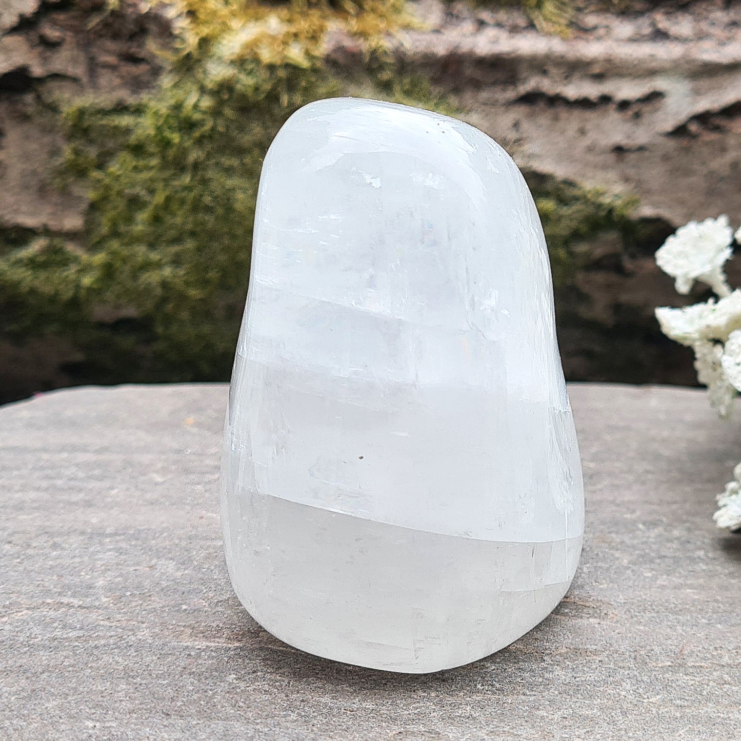 Calcite Freeform, White Calcite Freeform. In the light this crystal is very sparkly and a lot of light reflection. There are rainbows within this crystal.
