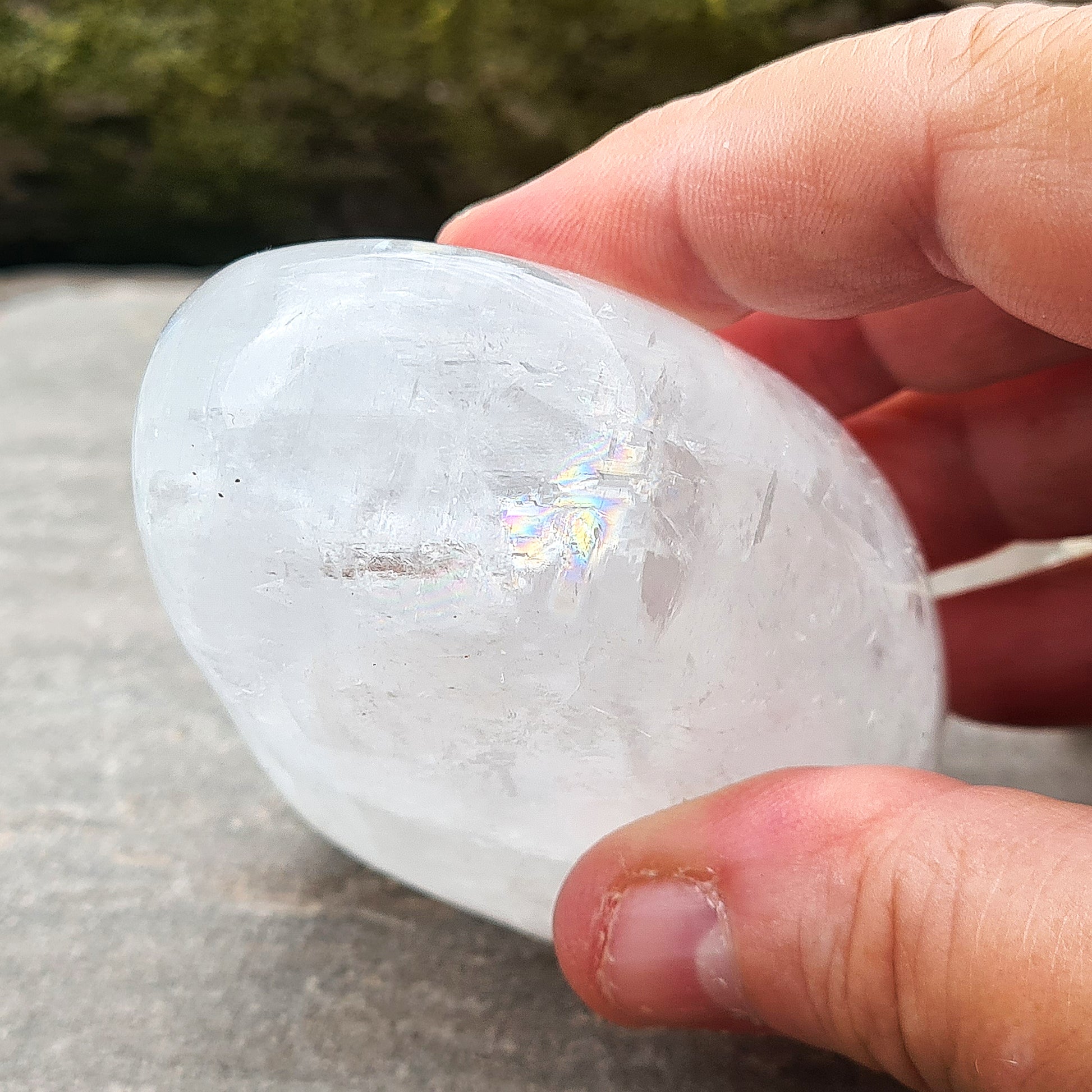 Calcite Freeform, White Calcite Freeform. In the light this crystal is very sparkly and a lot of light reflection. There are rainbows within this crystal.