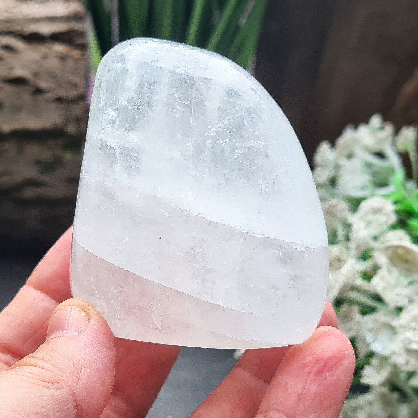 Calcite Freeform, White Calcite Freeform. In the light this crystal is very sparkly and a lot of light reflection. There are rainbows within this crystal.