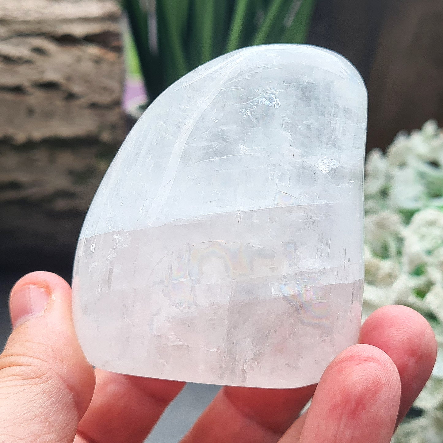 Calcite Freeform, White Calcite Freeform. In the light this crystal is very sparkly and a lot of light reflection. There are rainbows within this crystal.