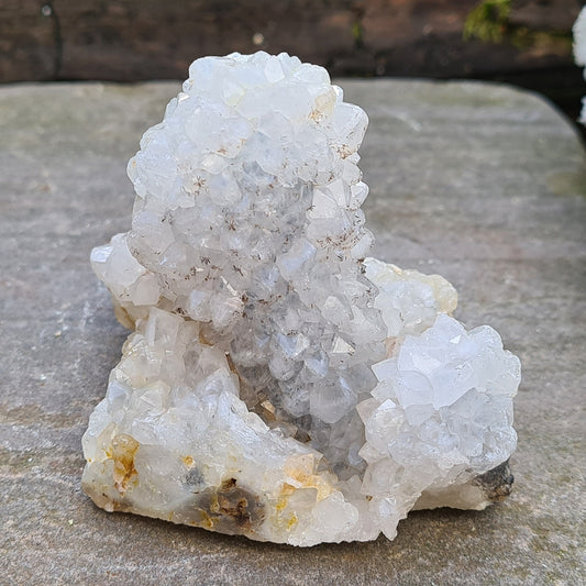 Stalactite Quartz from India. This one looks like it has a 'sugar coating of sparkling quartz crystals. Stalactites are created when mineral rich water drips from the ceiling of a cave to create hanging crystal formations.