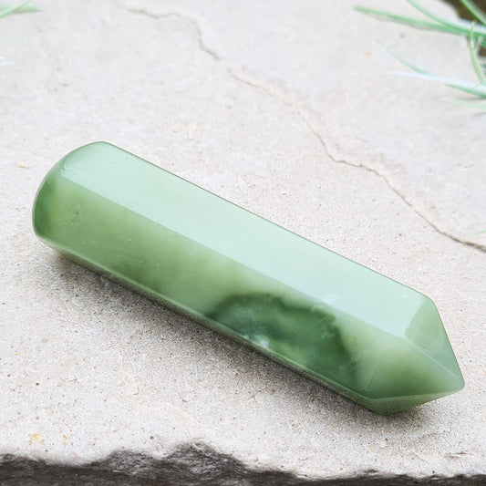 New Jade Wand. New Jade is also known as Bowenite, which is a variation of the Serpentine group of minerals. From South Africa. The energy of New Jade is soft and gentle in this wand shape.